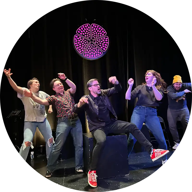 Very Very Improv group members acting out a prompt