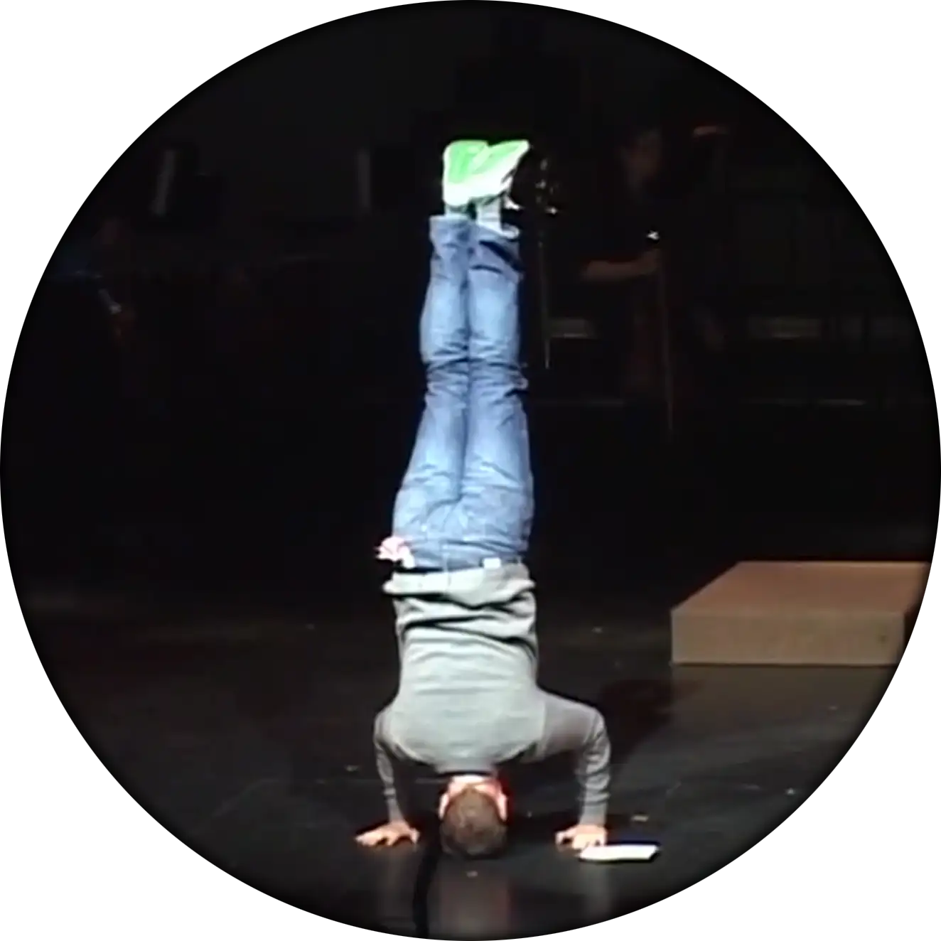 Cliff doing a headstand while emceeing an event