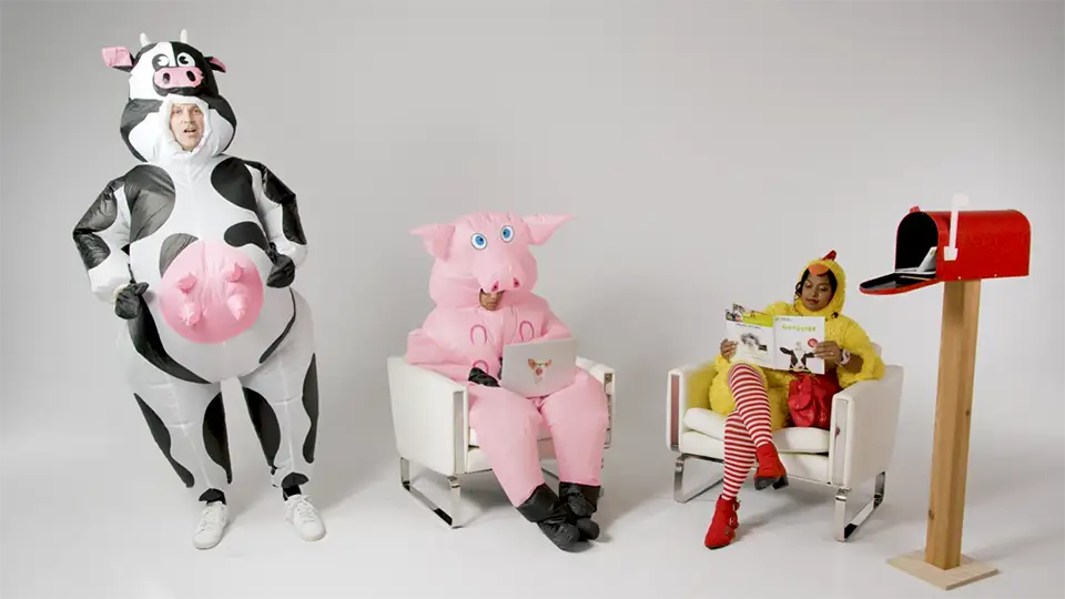 Cliff in a cow costume with Marika and Jaedon in chicken and pig costumes