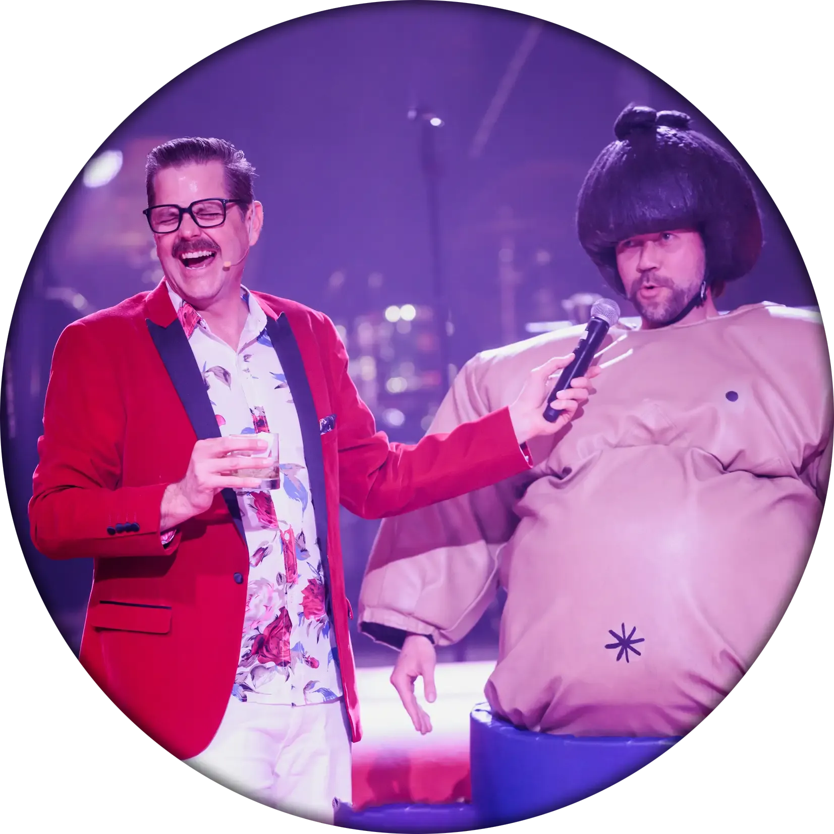 Cliff hosting a sumo event 