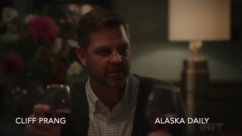 cliff with HILLARY SWANK at a dinner table holding a glass of wine