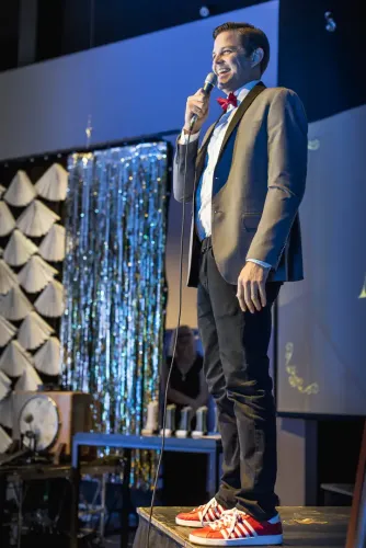 Cliff on stage hosting an Arty Awards evening