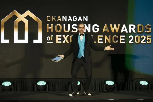Cliff on stage emceeing the Okanagan Housing Awards of Excellence evening