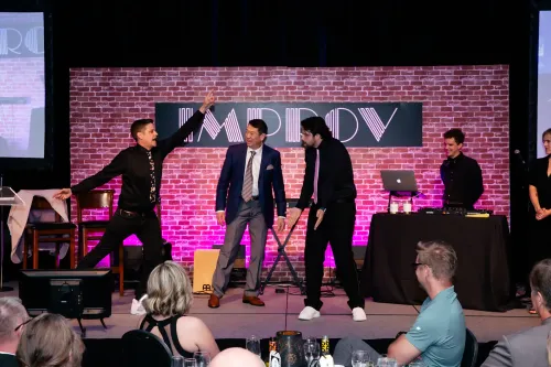 Cliff on stage doing improv for a corporate event