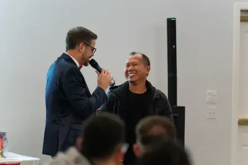Cliff hosts an interview with an individual in front of the audience