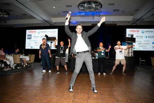 Cliff leading participants as they dance at an event