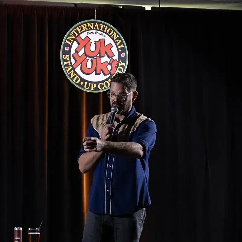cliff performing stand-up comedy at Yuk Yuk's